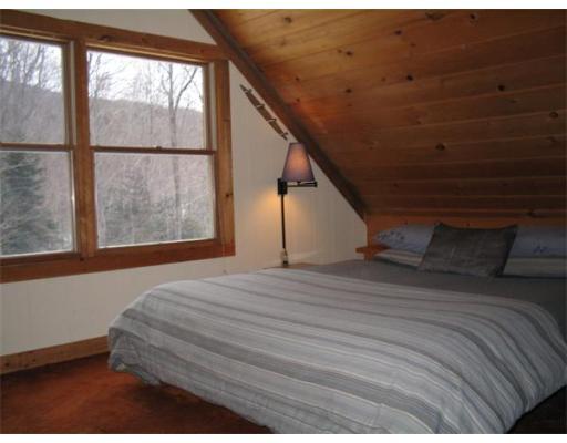 84 Moores Road Florida, MA 01343 - Photo 9 of 13 a bedroom with a bed and a window