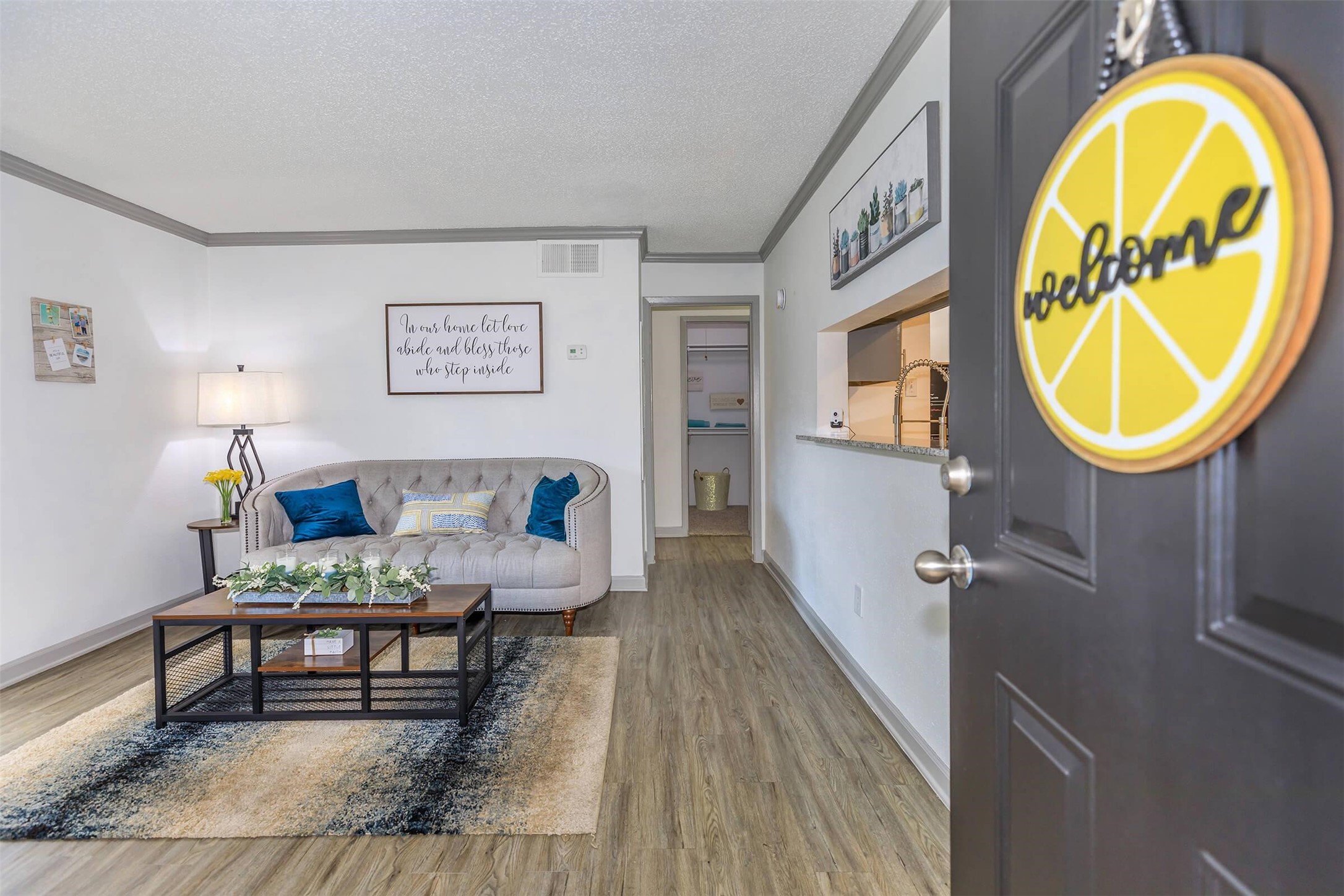 265 El Dorado Boulevard, Unit 2323 Webster, TX 77598 - Photo 3 of 30 a living room with furniture and a wooden floor