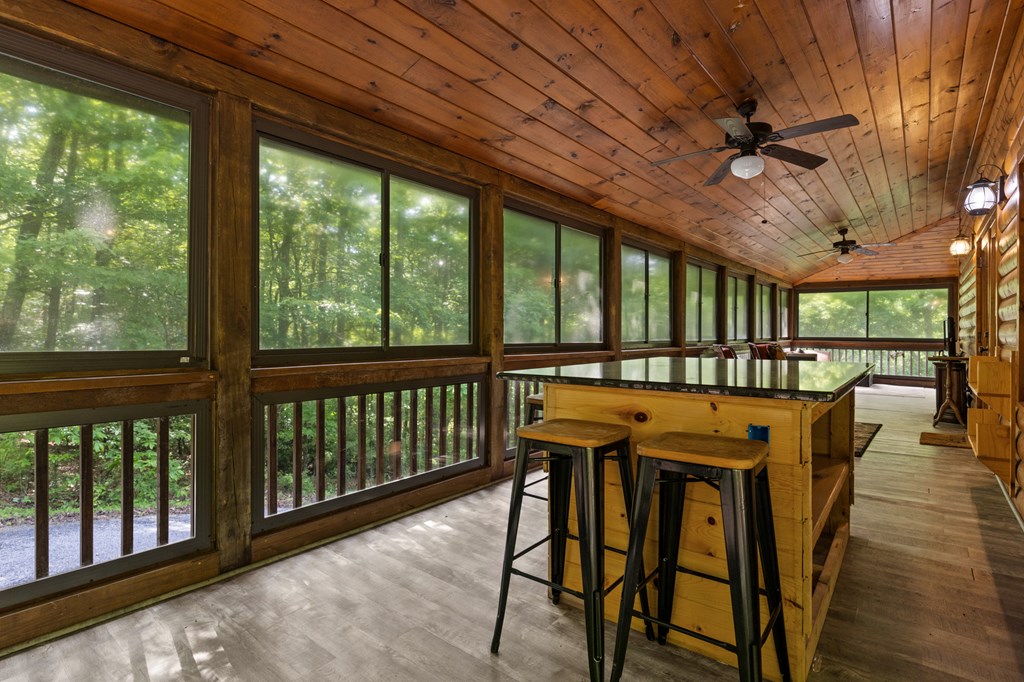 220 Solar Drive Blue Ridge, GA 30513 - Photo 30 of 59 a view of a dining room with furniture window and wooden floor