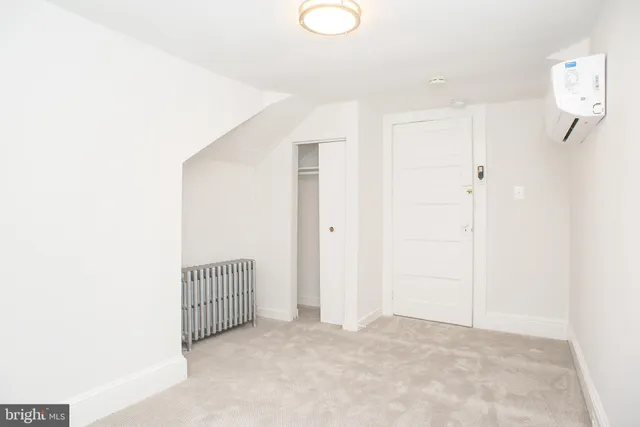 a view of a room with white walls