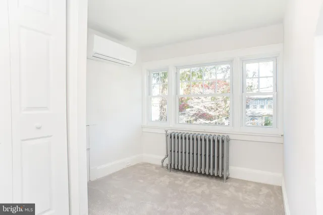 a bathroom with a sink vanity tub and a mirror