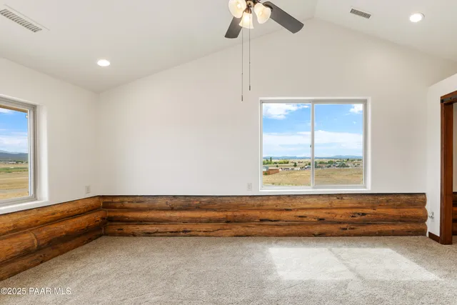 a view of room with window and hardwood floor