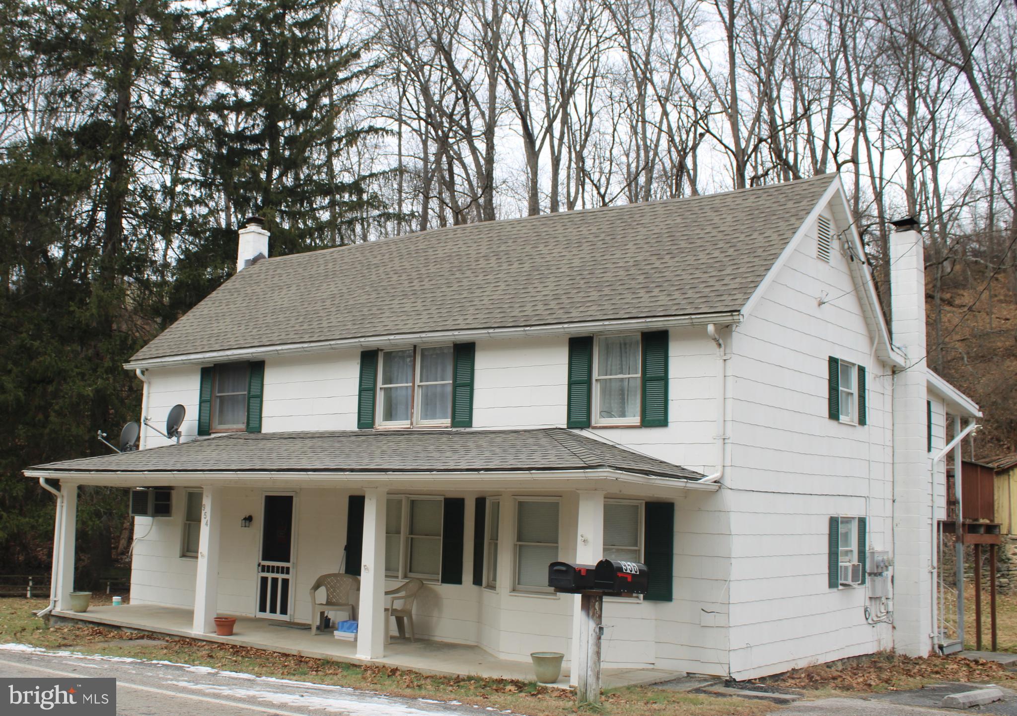 956 Toad Valley Road Glen Rock, PA 17327 - Photo 1 of 11 a front view of a house with a tree