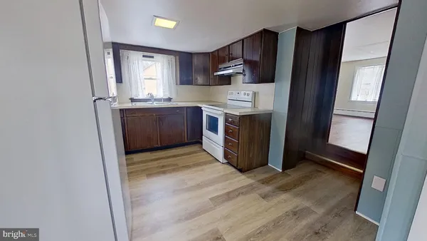 a kitchen with stainless steel appliances a refrigerator and a stove
