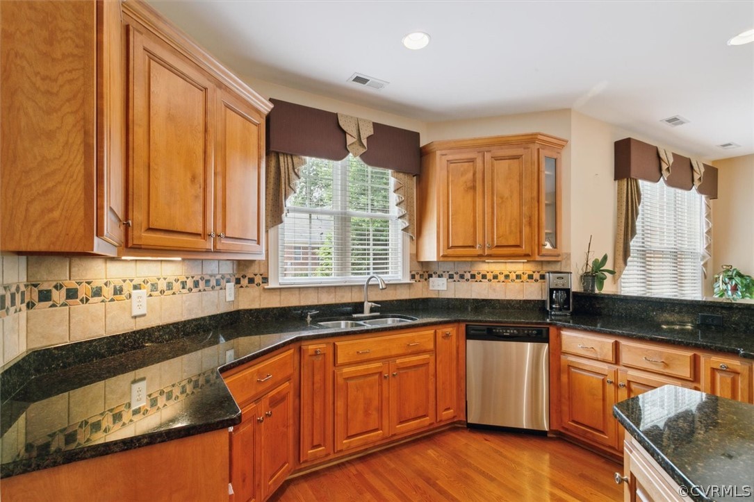 4035 Powhatan Secondary Williamsburg, VA 23188 - Photo 20 of 50 a kitchen with granite countertop a sink and a stove top oven