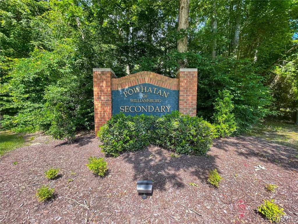 4035 Powhatan Secondary Williamsburg, VA 23188 - Photo 2 of 50 a sign board with a house in the background