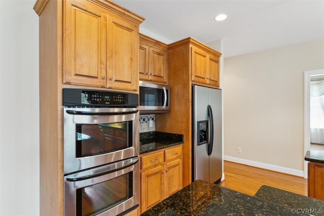 4035 Powhatan Secondary Williamsburg, VA 23188 - Photo 22 of 50 a kitchen with stainless steel appliances granite countertop a stove and a refrigerator