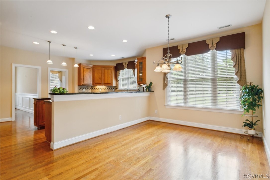 4035 Powhatan Secondary Williamsburg, VA 23188 - Photo 23 of 50 a large kitchen with granite countertop a large counter top a sink stainless steel appliances and cabinets