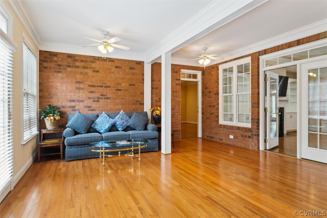 4035 Powhatan Secondary Williamsburg, VA 23188 - Photo 26 of 50 a living room with furniture and floor to ceiling windows