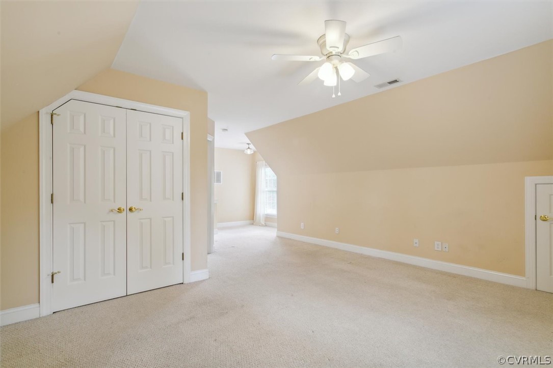 4035 Powhatan Secondary Williamsburg, VA 23188 - Photo 39 of 50 a view of an empty room with a ceiling fan