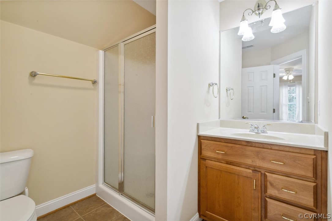 4035 Powhatan Secondary Williamsburg, VA 23188 - Photo 41 of 50 a bathroom with a granite countertop sink a toilet and a mirror