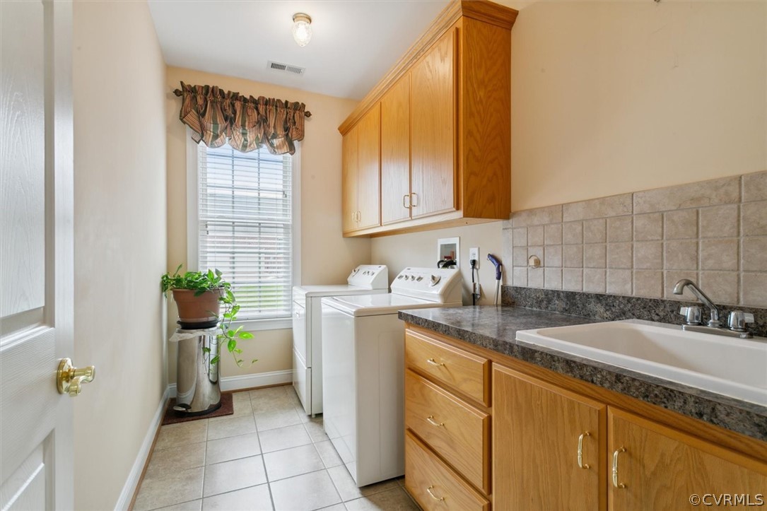 4035 Powhatan Secondary Williamsburg, VA 23188 - Photo 42 of 50 a kitchen with a sink and cabinets