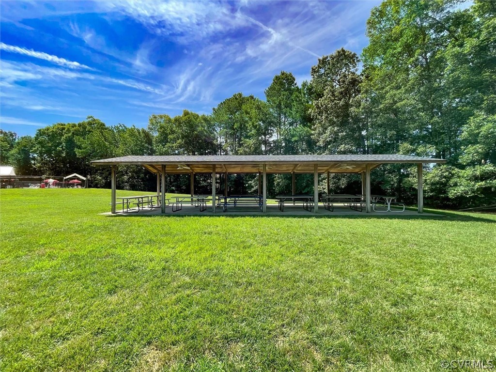 4035 Powhatan Secondary Williamsburg, VA 23188 - Photo 50 of 50 a view of a house with a backyard