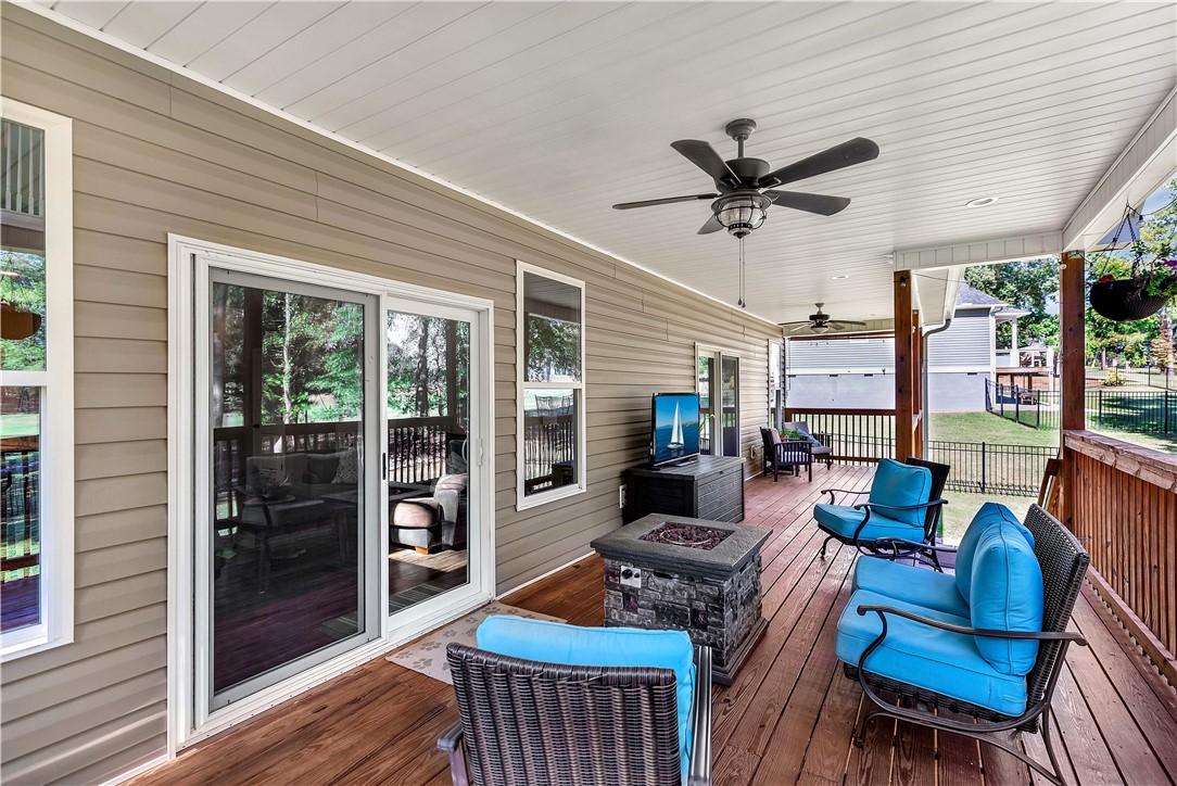 3004 Cobbs Way Anderson, SC 29621 - Photo 29 of 46 An expansive covered wooden deck provides comfortable outdoor living space with recessed lighting and siding details.