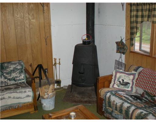 81 Pine Street Stratton, ME 04982 - Photo 5 of 15 Living Room. Wood Stove