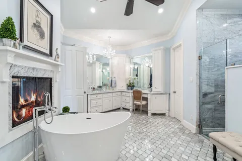 a large white kitchen with a large window