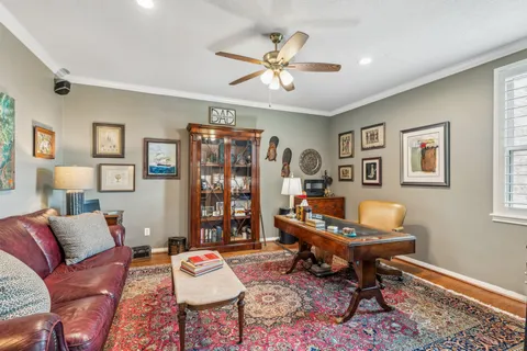 a living room with furniture and a rug
