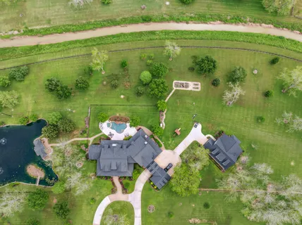 a aerial view of a house with a lake view
