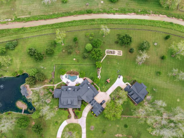 a aerial view of a house with a lake view