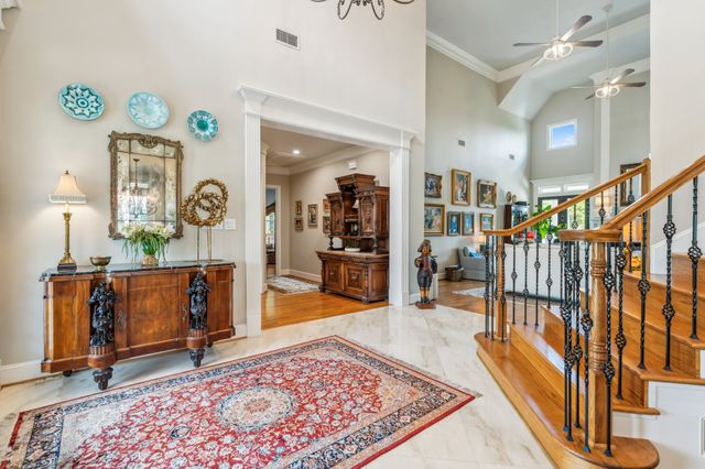 an entryway with a rug and a rug