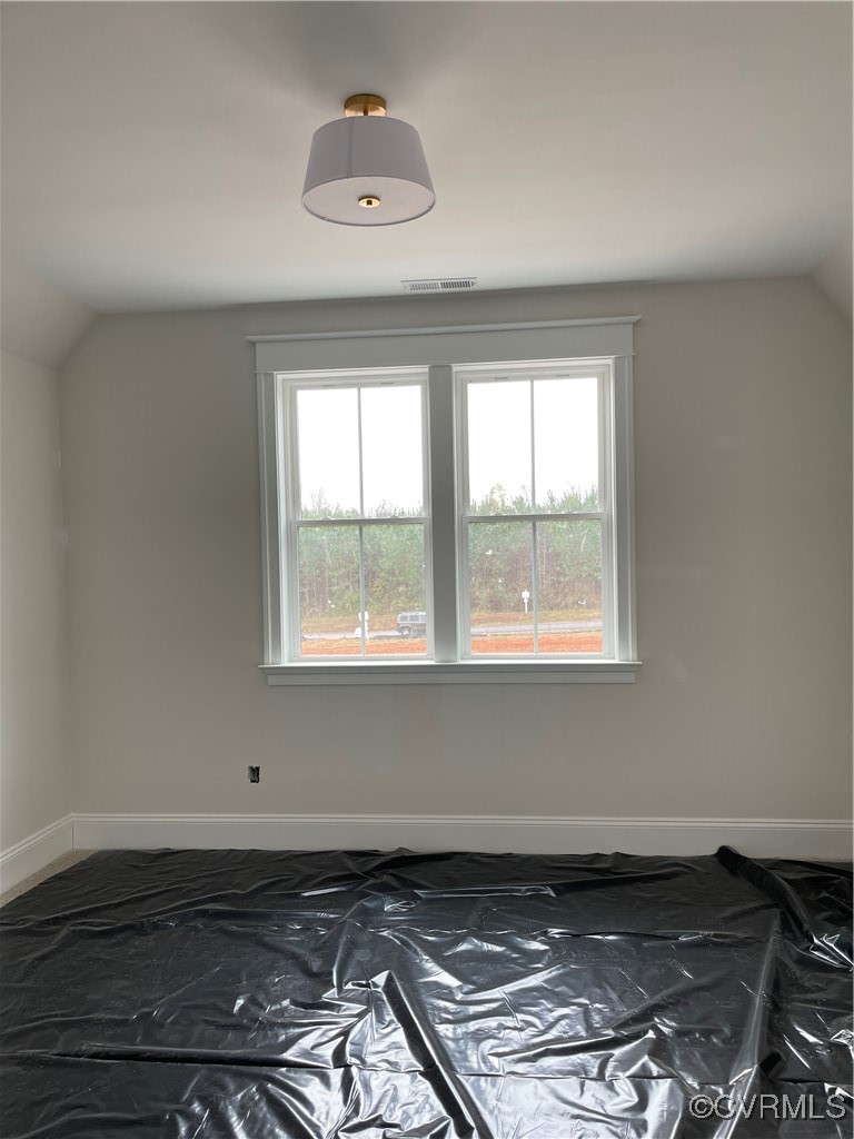 1532 Smokey Rdg Road Maidens, VA 23102 - Photo 13 of 16 an empty room with wooden floor and windows
