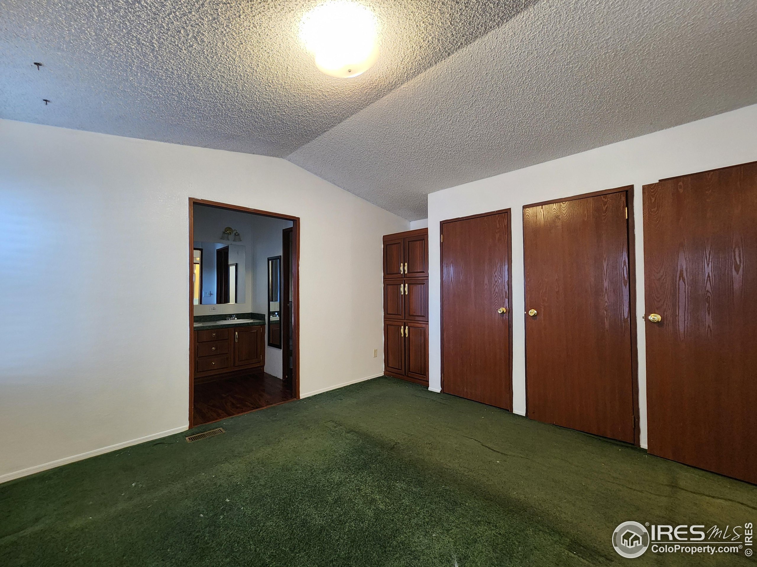 5000 Butte Street, Unit 208 Boulder, CO 80301 - Photo 16 of 37 a view of an empty room with closet and wooden floor
