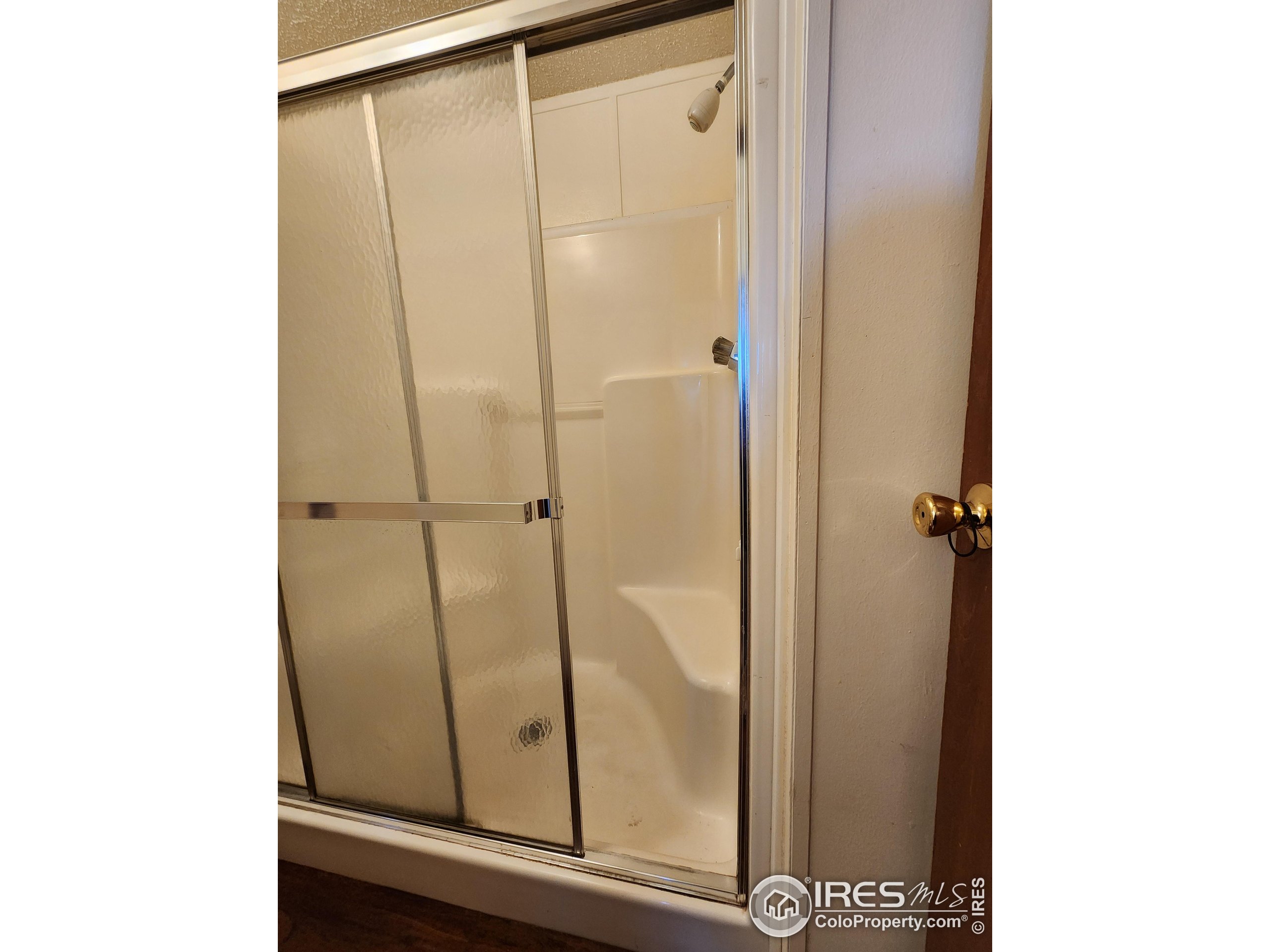5000 Butte Street, Unit 208 Boulder, CO 80301 - Photo 21 of 37 a bathroom with a glass shower door