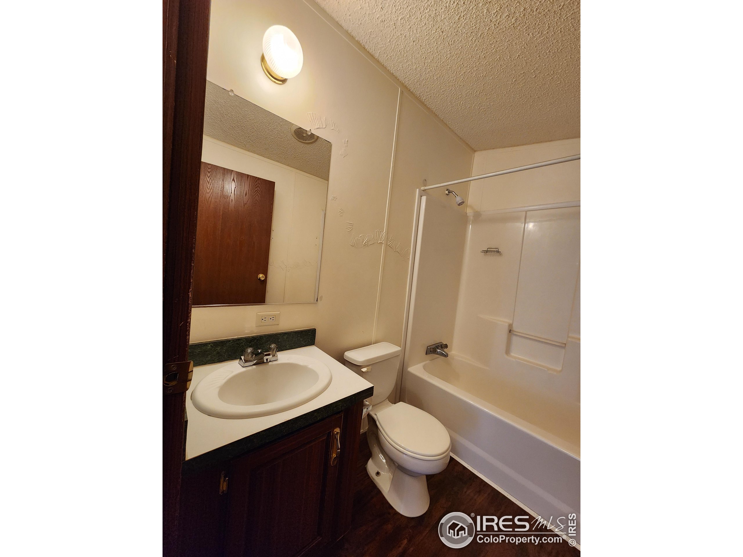 5000 Butte Street, Unit 208 Boulder, CO 80301 - Photo 27 of 37 a bathroom with a sink toilet a mirror and shower