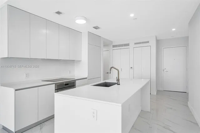 a view of an empty room with sliding glass door and mountain view