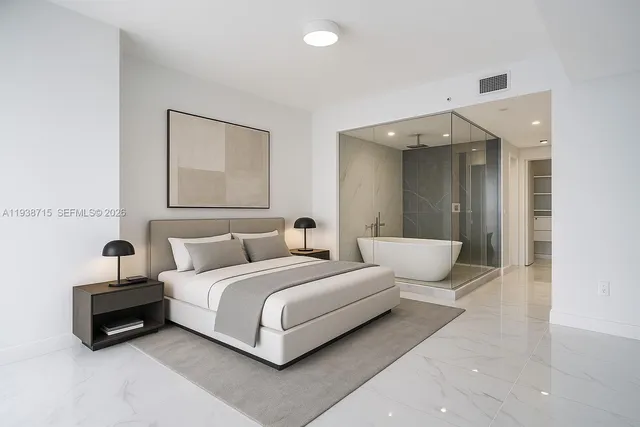 an empty room with white walls and glass door