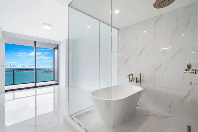 a bathroom with a bathtub and a toilet