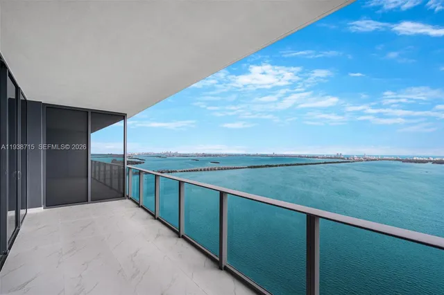 a view of a green field with clear sky