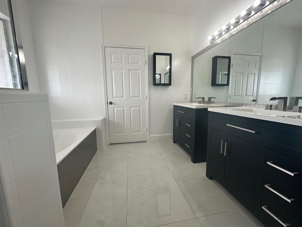 14024 Southwest 132nd Avenue Miami, FL 33186 - Photo 15 of 24 a kitchen with a sink and cabinets