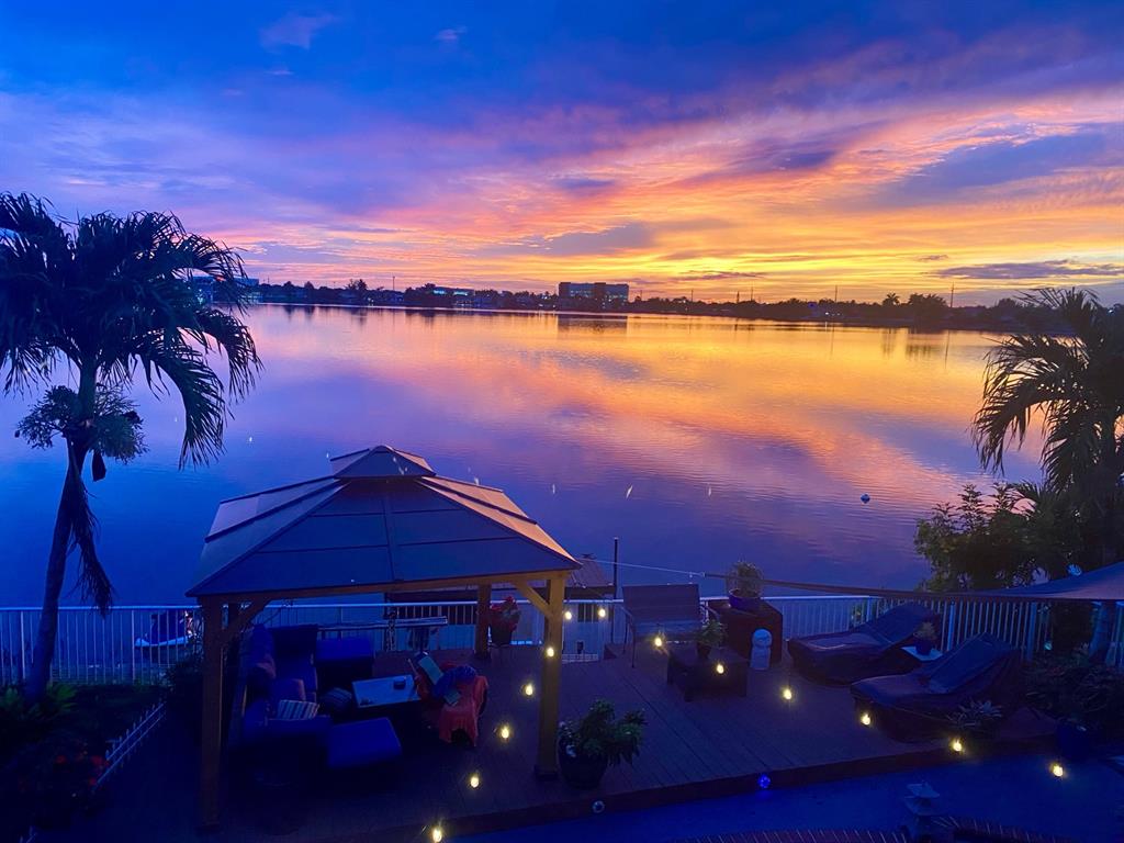 14024 Southwest 132nd Avenue Miami, FL 33186 - Photo 21 of 24 a view of a lake from a yard