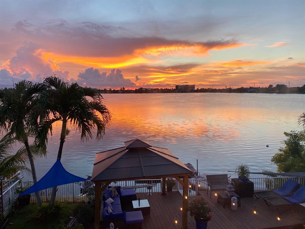 14024 Southwest 132nd Avenue Miami, FL 33186 - Photo 22 of 24 a front view of a house with a lake view