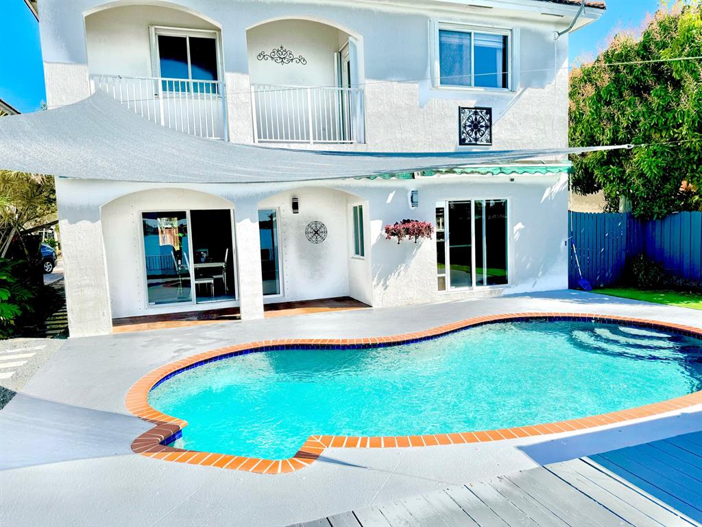 14024 Southwest 132nd Avenue Miami, FL 33186 - Photo 4 of 24 a view of swimming pool with a lounge chairs