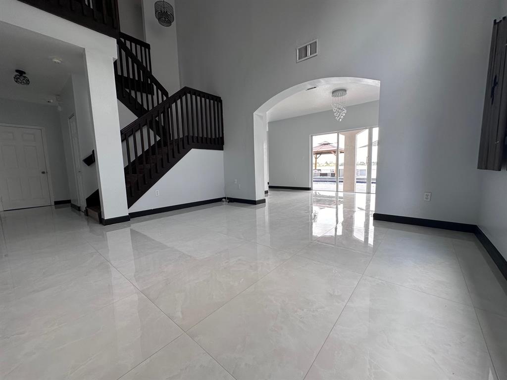 14024 Southwest 132nd Avenue Miami, FL 33186 - Photo 8 of 24 a view of entryway and hall with a window