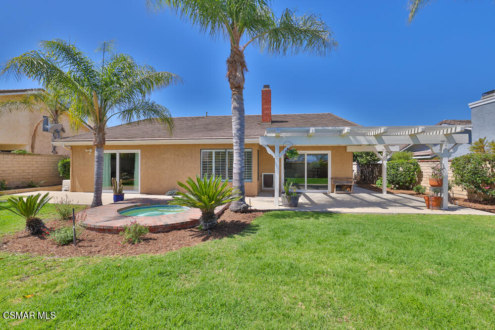 3920 Southhampton Road Moorpark, CA 93021 - Photo 33 of 41 a front view of a house with patio and garden