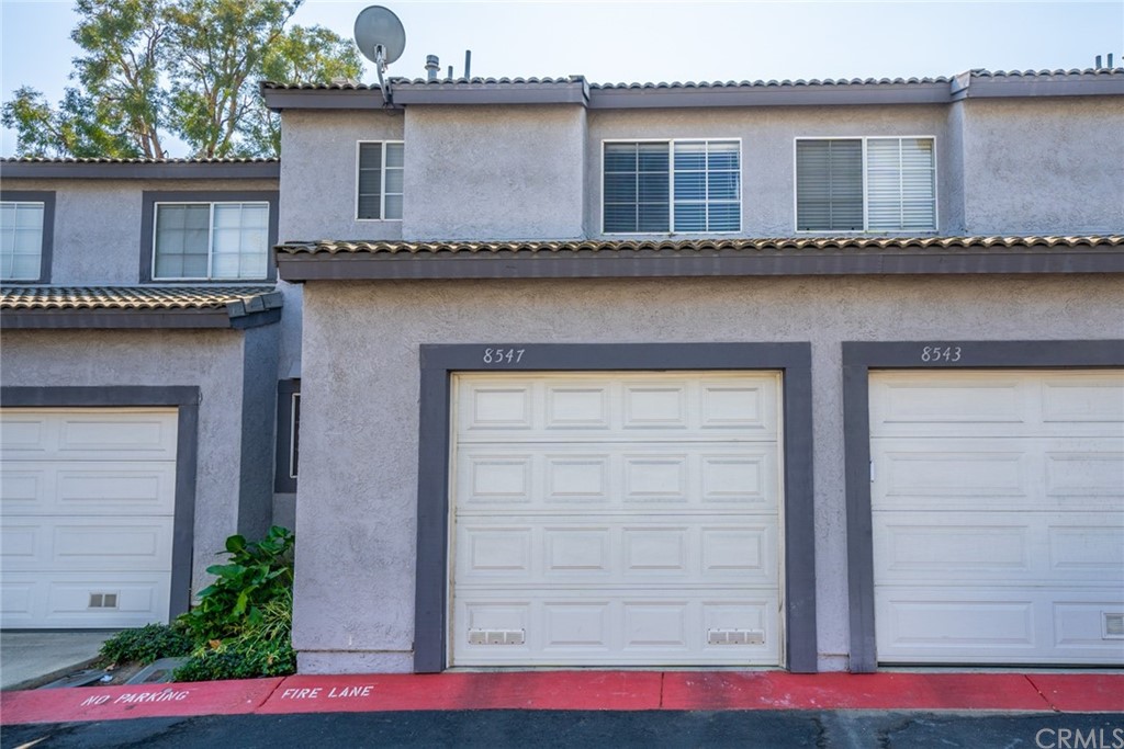 8547 Stonegate Drive Rancho Cucamonga, CA 91730 - Photo 1 of 1 a couple of potted plants in front of door
