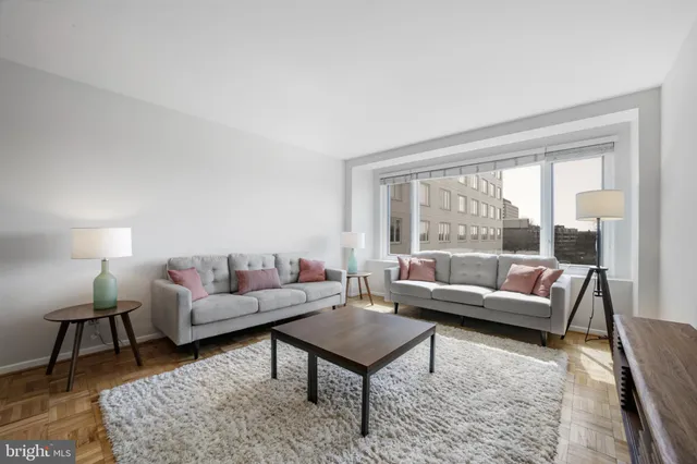 a living room with furniture and a rug