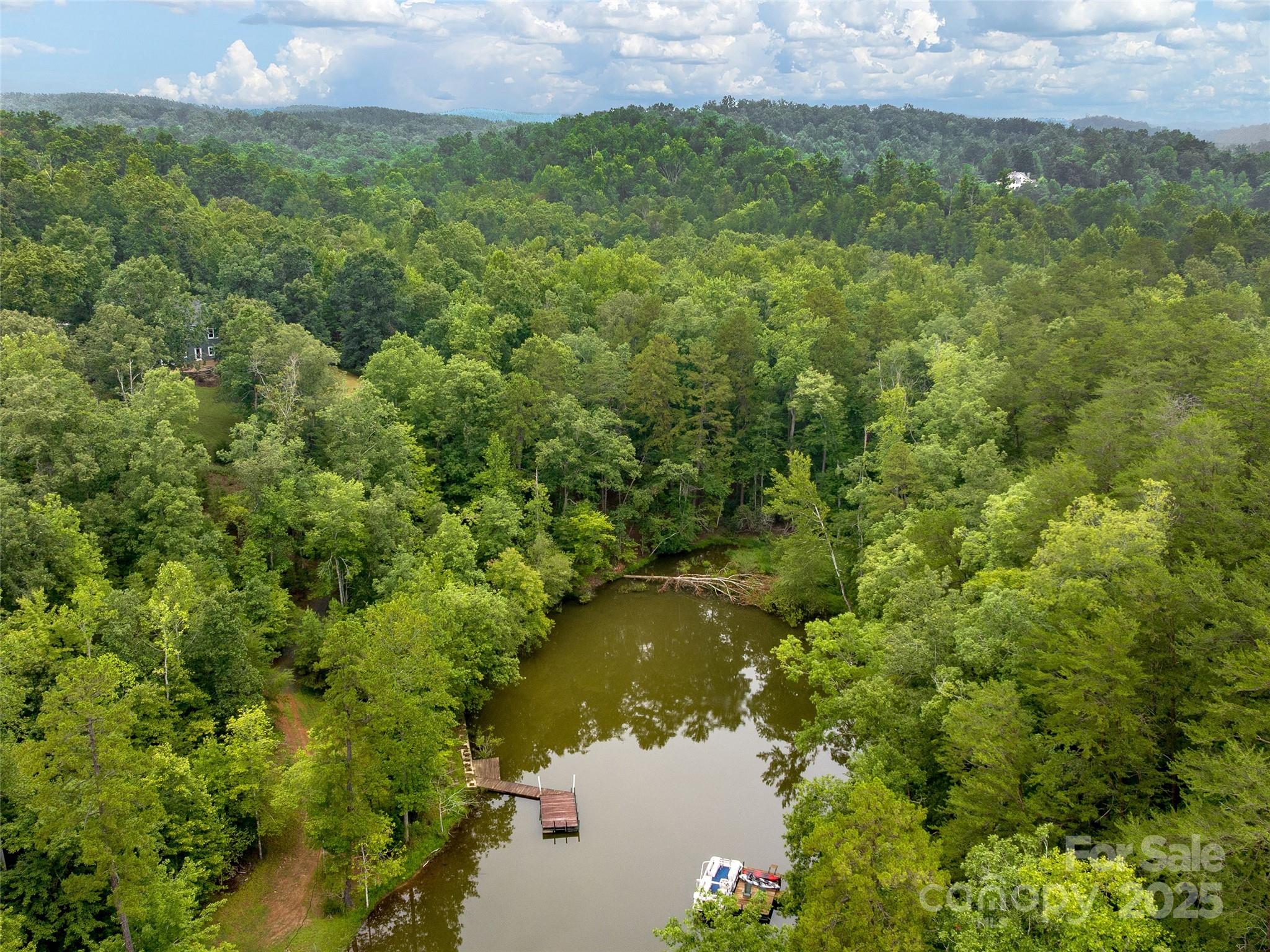 Lot #28 Parkway North Rd Mill Spring, Unit 28 Mill Spring, NC 28756 - Photo 12 of 23 a view of a lake and a yard