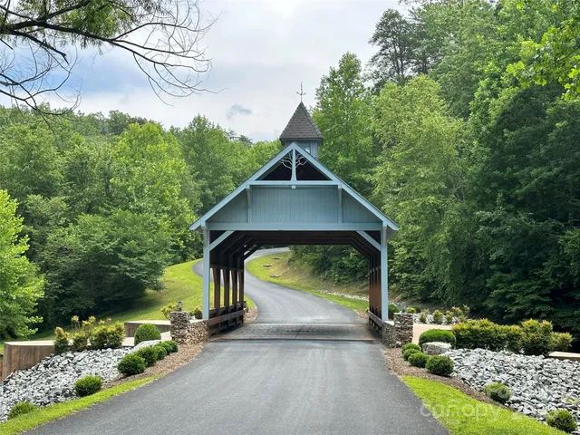 a view of a small house with a street