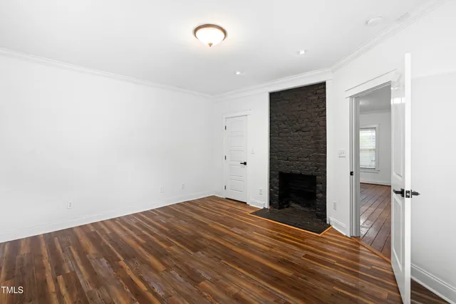a view of a backyard with table and chairs and wooden fence