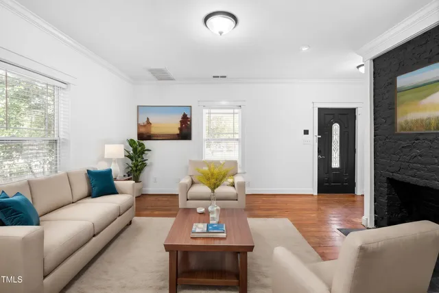a living room with furniture and a fireplace