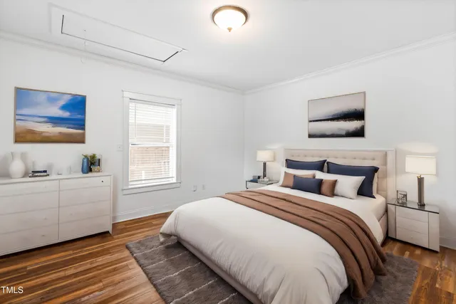 a bedroom with a bed and window