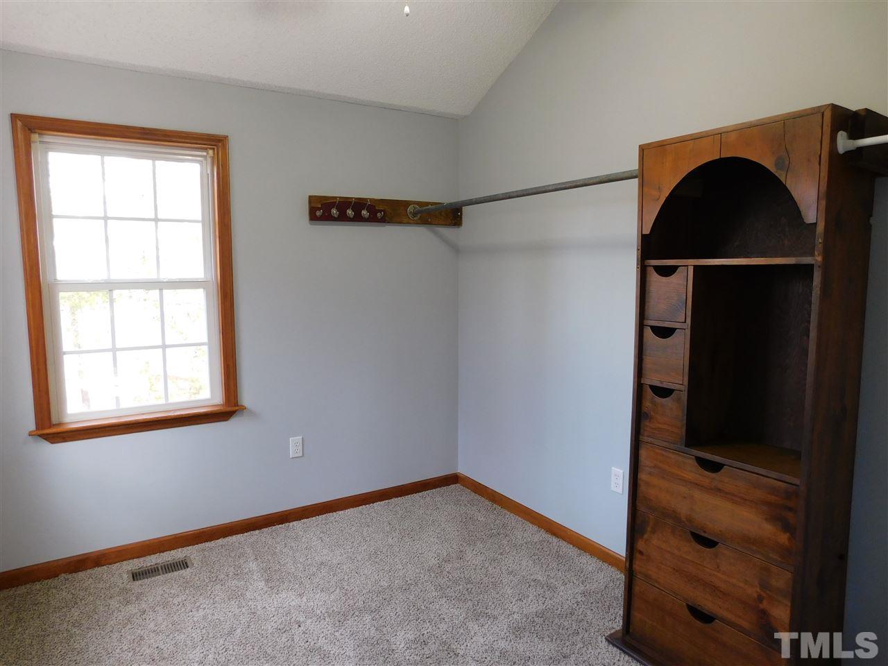 2425 Canvasback Court Raleigh, NC 27616 - Photo 14 of 20 an empty room with a closet and wooden floor