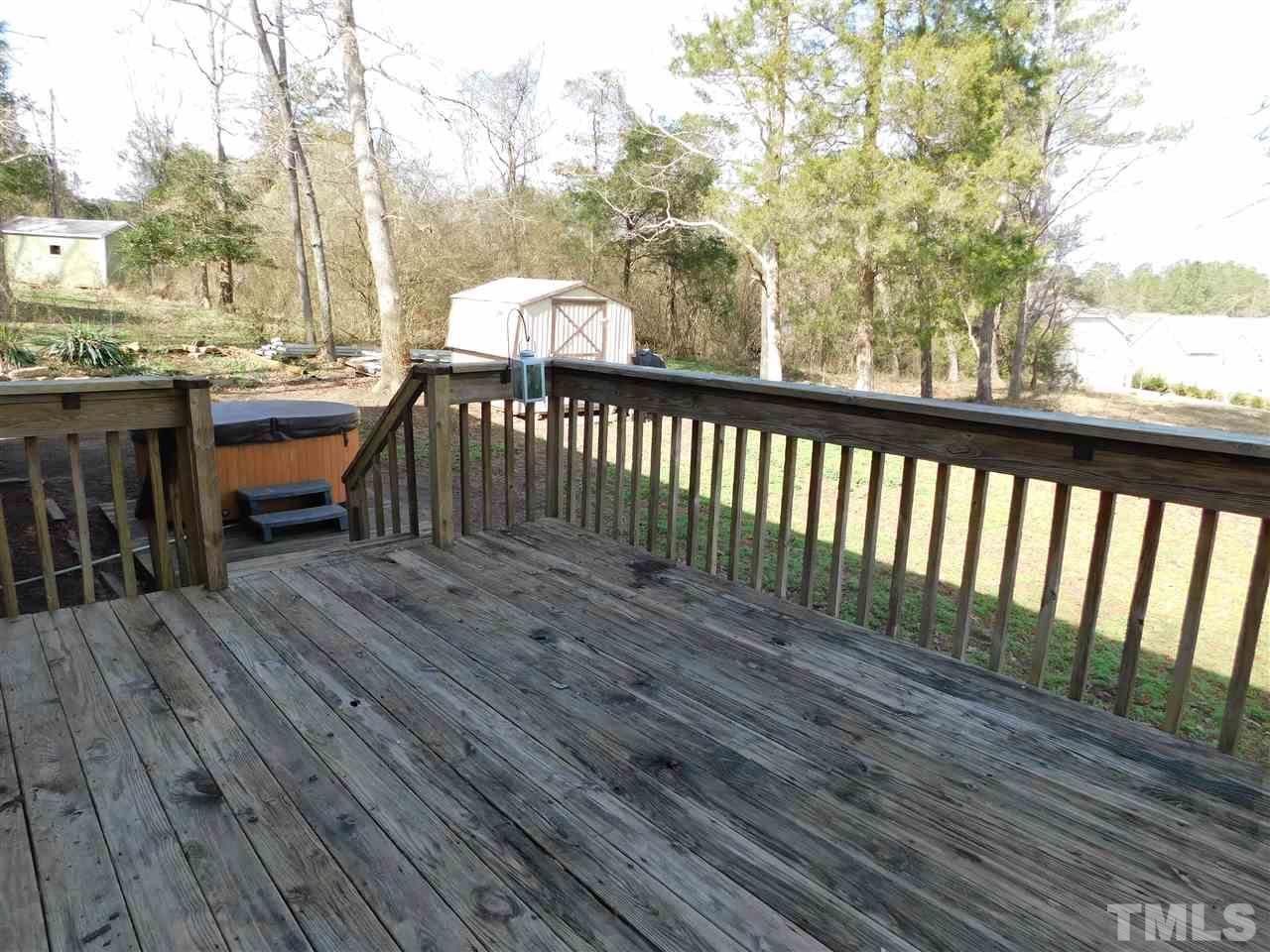 2425 Canvasback Court Raleigh, NC 27616 - Photo 8 of 20 a balcony with wooden floor table and chairs