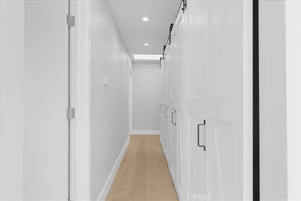 a view of a hallway with white walls