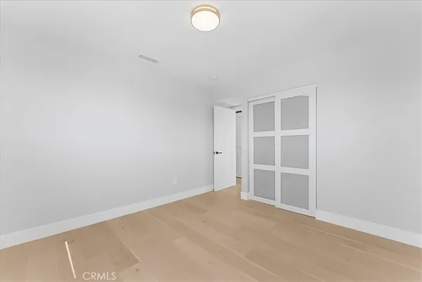 an empty room with a empty space and a window