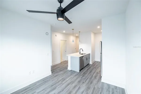 a view of a kitchen with wooden floor